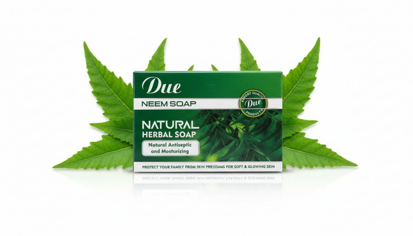 Due Neem Soap bar with green leaves on a white background