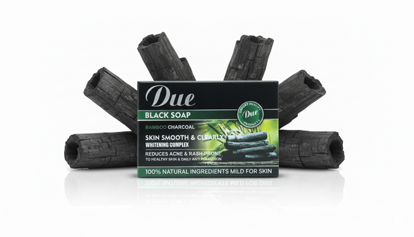 Black soap bars with packaging labeled 'Due' on a white background